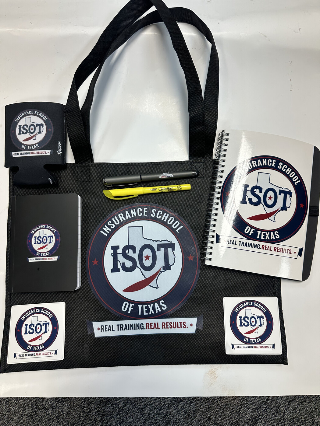 The ISOT student kit: tote bag, spiral notebook, journal, pen, highlighter, koozie and stickers